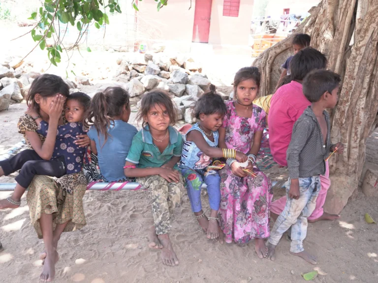 Underprivileged tribal children receiving community support through Shree Shakti Seva Kendra (SSSK), a child welfare NGO working for education, nutrition, healthcare, and rural development in Gujarat.
