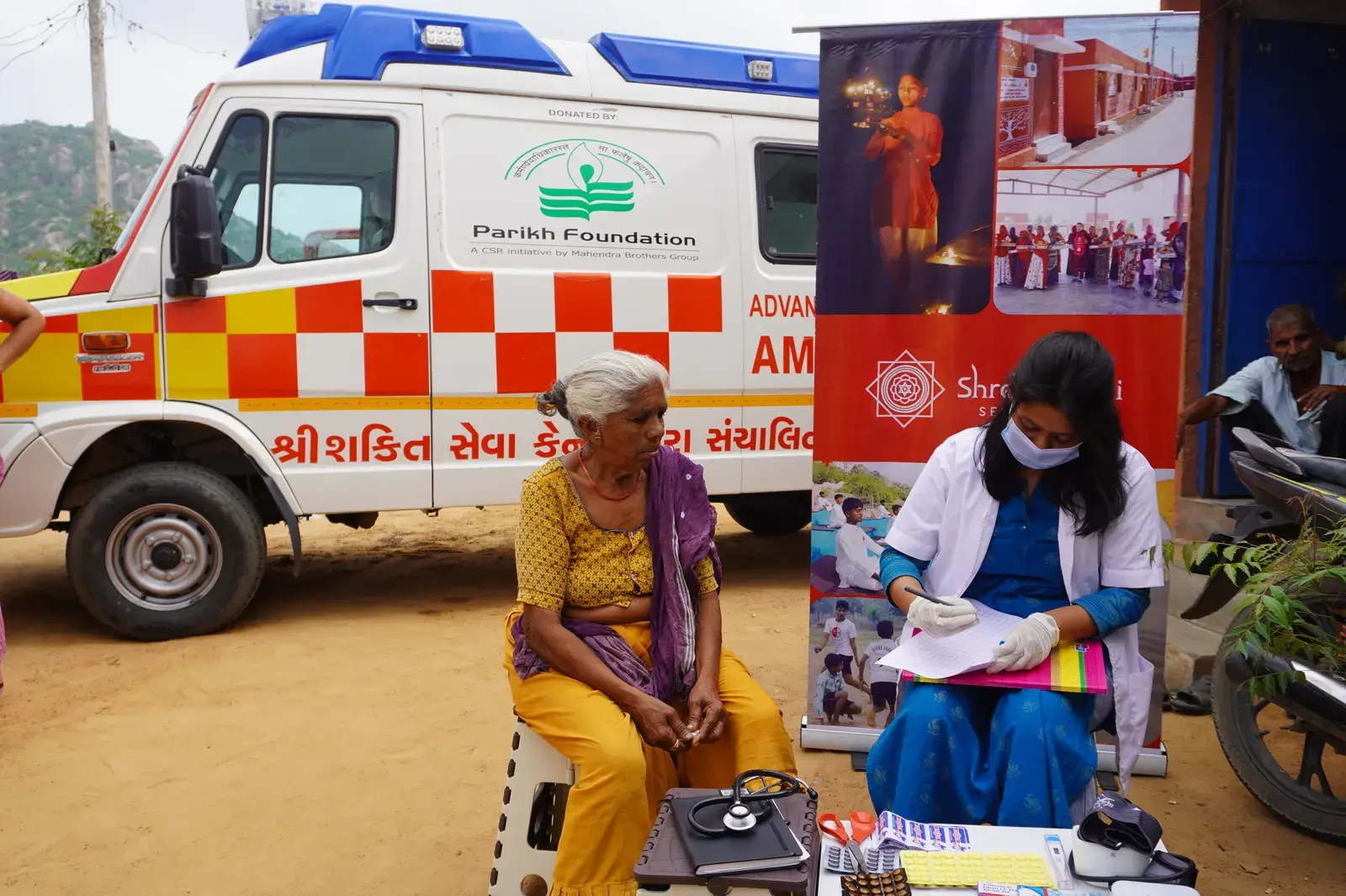 Medical team consulting community members at Jalotara medical camp