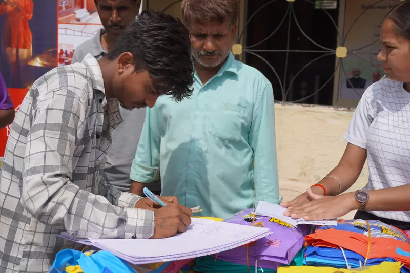 SSSK Raincoat Distribution Drive in Pancha Village, Ambaji - 300 raincoats distributed to tribal families