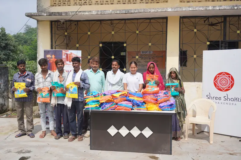 SSSK team distributing raincoats to tribal community members in Pancha Village